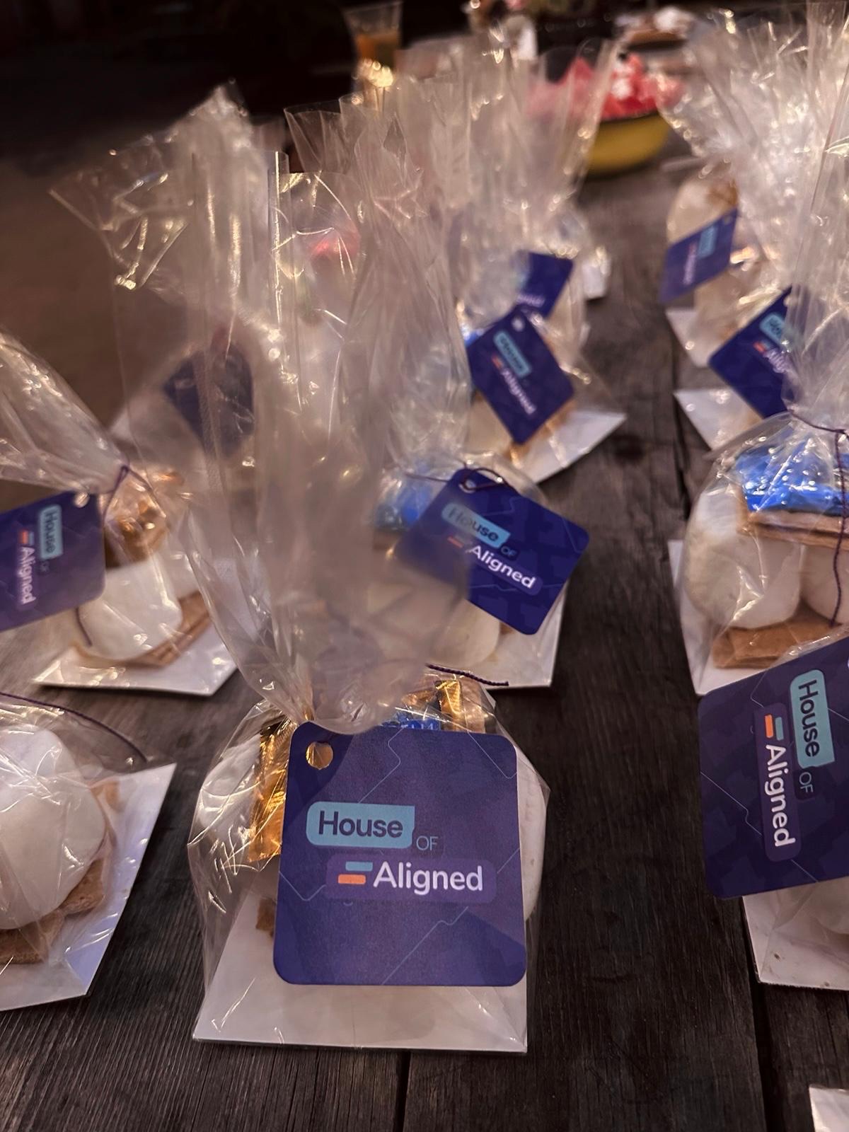 Rows of clear-bagged s'mores kits with House of Aligned branded tags